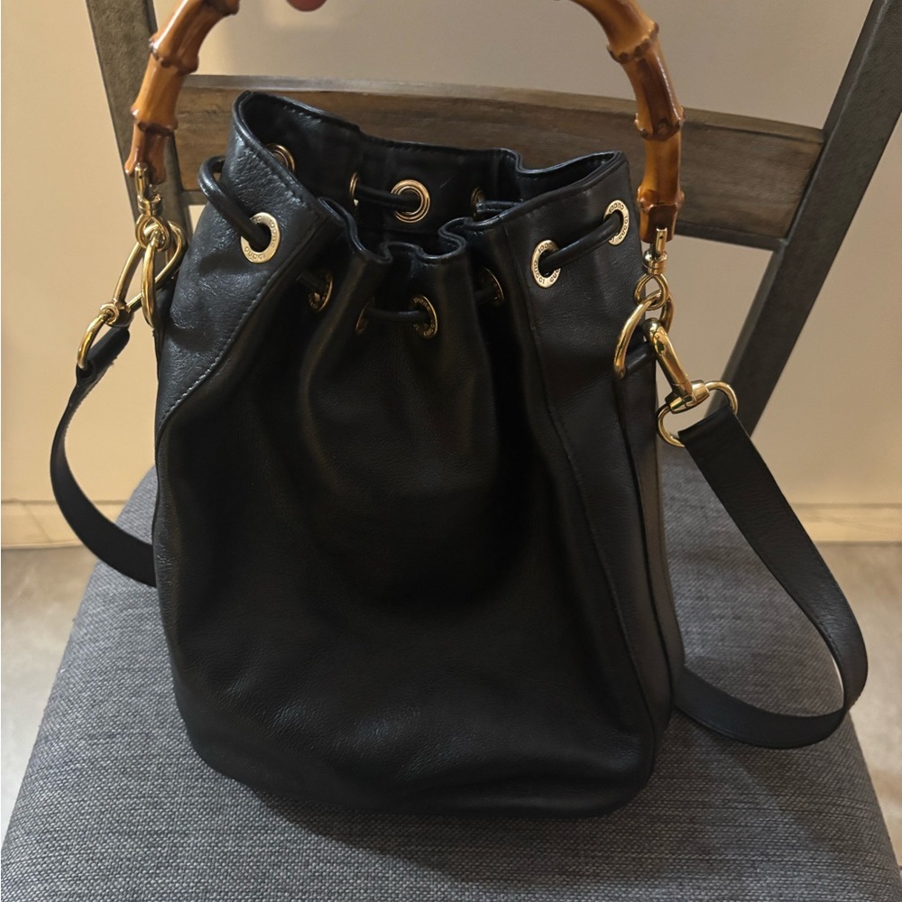 Guccis Black Shoulder Bag with Bamboo Handle and Gold Hardware
